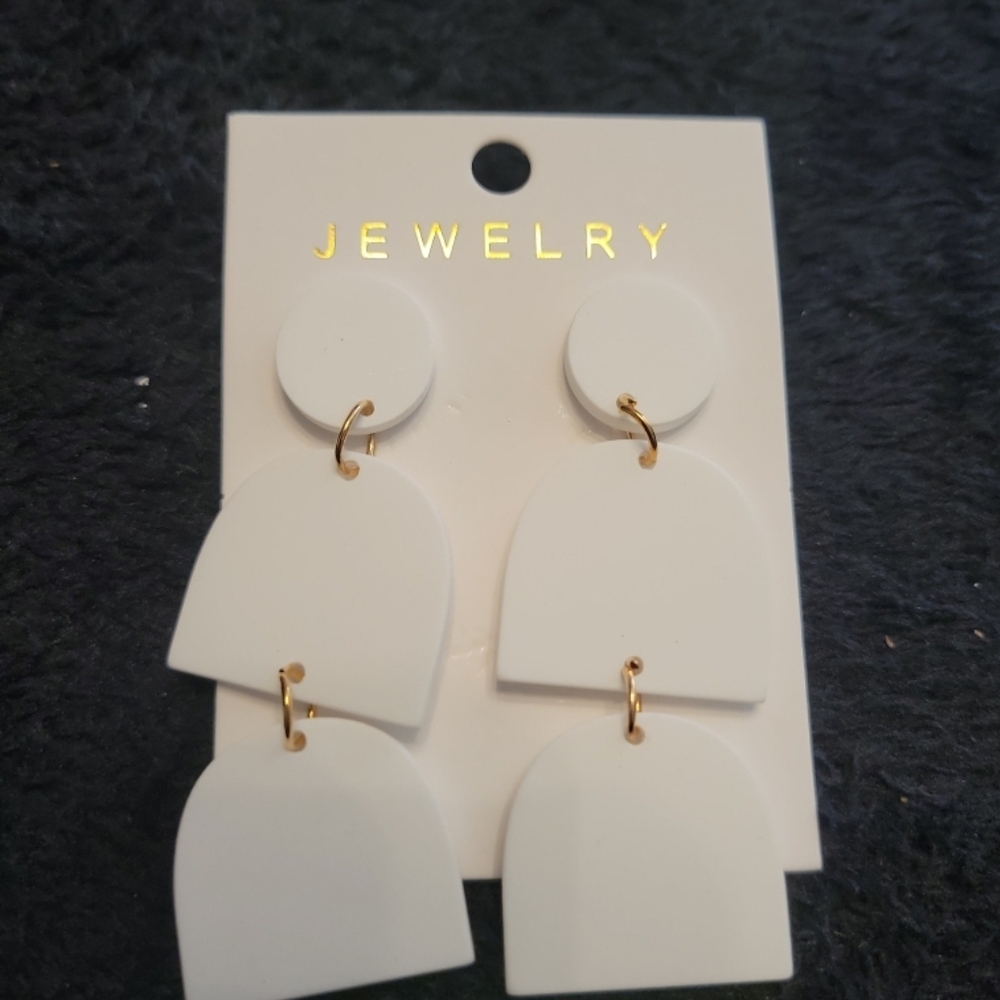 White dangle earrings